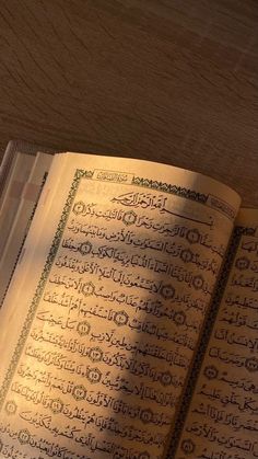 an open book with arabic writing on it