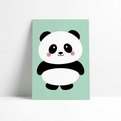 a panda bear is sitting on top of a green square wall art print with black and white