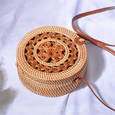 Bali Handmade Woven Rattan Bag Round Straw Shoulder Bag Women Summer New Hollow Out Retro Crossbody Bag Boho Beach Circle Bag Handmade handwoven ratta bean bags.This handcrafted bag is made with hand-harvested material and features a handle for carrying all your essentials. It's soft, lightweight, warm and has a detachable shoulder strap to keep it all together in one place! This bag also comes fully lined so you can carry all the necessities as you go about your shopping or travel. The bag carr Traditional White Bags For Vacation, Brown Large Capacity Straw Bag As A Gift, Brown Straw Bag With Large Capacity For Gift, Brown Large Capacity Straw Bag For Gift, Summer Shoulder Bag With Adjustable Strap As Gift, Natural Summer Shoulder Bag As Gift, Summer Natural Shoulder Bag As Gift, Traditional White Shoulder Bag For Beach, Traditional White Shoulder Bag For The Beach