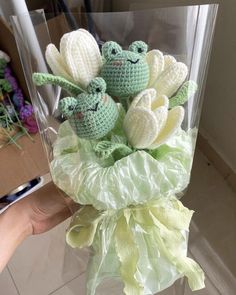 there are crocheted stuffed animals in a vase