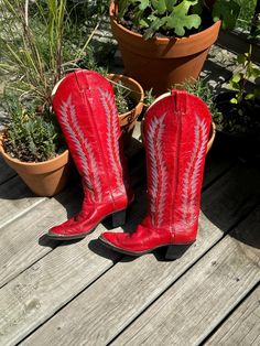 Vintage Larry Mahan red embroidered leather western boots with silver metal tips.  The leather shows some wear, but they just need a polish. These boots still have a ton of life in them. The soles and heels are in very good condition.  Size 6 narrow Measures 17" tall, the heel is 2 1/4".  Made in Texas Red Snip Toe Boots For Western-themed Events, Red Pointed Toe Boots For Western-themed Events, Red Cowboy Boots, Leather Western Boots, Embroidered Leather, Western Cowgirls, Western Cowgirl, Cowgirl Boots, Western Boots