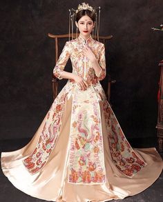 ⭐ Premium Handmade Item, High End Quality Gown; The very Elegant quality for Brides; ⭐ Item High Light: Classical Red Color; 4D Solid Tailor to Show Bride's Shape Beauty; Premium Satin Material Surface; Embroidery Golden Pattern盘金绣; Tassel jewelry decoration in front Chest and Sleeves/ Hemline; Tassel Satin with Pattern Skirt; Symmetrical Art design to show the beauty of Chinese Royal Wedding Fashion. ⭐ Made for Spring/Summer/ Autumn Season; Clothing Match Tips: Match to Loose Qipao Jacket/ High Red Brocade Wedding Dress, Brocade Ball Gown Wedding Dresses, Brocade Ball Gown For Wedding, Brocade Dress For Wedding And Festivals, Brocade Wedding Dress For Festivals, Traditional Wedding Dress With Long Train, Long Sleeve Dresses With Floral Embroidery For Ceremony, Long Sleeve Floral Embroidery Dress For Ceremony, Fitted Floor-length Gown With Multicolor Embroidery