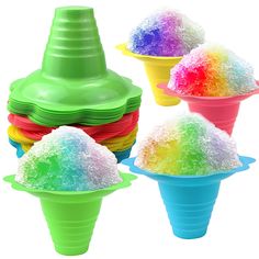 four ice cream cones with different colored toppings on them and one cone filled with sugar