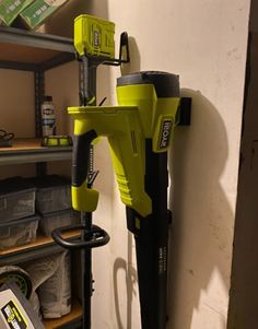 a cordless driller mounted to the side of a wall in a storage room