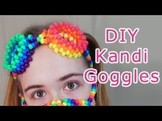 a woman with colorful hair clips on her face and the words diy kandi goggles