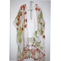 Lightweight Floral Spring Summer Boho Kimono, Kimono, Summer Kimono with Paisley Print Tassle Beach Cover Boho Clothing, SWIM COVER UP, KIMONO, BOHO STYLE CLOTHING, MEDITATION CLOTHING, OMBRE KIMONO, kimono, kimono cardigan, kimono jacket, women clothing, boho women clothing, kimono robe, boho kimono, bohemian kimono, bohemian clothing, kimonos, boho clothing, womans clothing Bohemian paisley is reimagined in this kimono with boarder print and tassels fringing the midi-length hem. Wrap yourself Bohemian Wrap Kimono For Brunch, White Floral Print Kimono For Festival, Bohemian Printed Kimono For Brunch, White Floral Kimono For Festival, Beach Kimono With Printed Details, Bohemian Multicolor Kimono For Brunch, Casual White Floral Print Cover-up, White Floral Print Kimono For Vacation, White Floral Kimono For Vacation