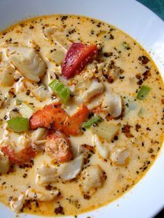 a white bowl filled with soup on top of a table