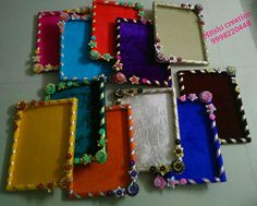 there are many different colored frames on the floor with beaded trimmings and beads