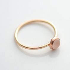 14k Yellow Gold Filled Ring with 5mm genuine rose quartz. Stackable ring. Also available in sterling silver and rose gold filled. This ring is made to order in your size. If you don't see your size available please feel free to message me. All orders ship in a gift box. If you are ordering multiple items and want them boxed separately, please let me know in the notes at checkout. I ship via USPS. Please review the estimated delivery date and processing times. Processing times vary based on how b Minimalist Rose Jewelry For Anniversary, Simple Rose Gold Jewelry With Birthstone, Simple Rose Gold Birthstone Jewelry, Delicate Rose Gold Stackable Rings With Round Band, Dainty Rose Quartz Jewelry In Rose Gold, Adjustable Rose Quartz Rose Gold Ring, Minimalist Rose Gold Oval Jewelry, Everyday Rose Gold Gemstone Rings, Simple Rose Gold Round Band Jewelry