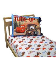 a bed with cars on it and the words home & garden essentials