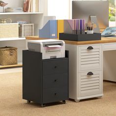 a computer desk with a printer on top of it and other office supplies in the background