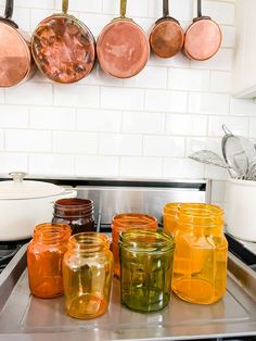 pots and pans are lined up on the stove