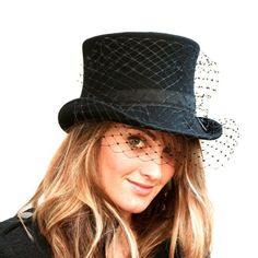 Black woman top hat made with wool or fur felt and embellished with black veil. Wearing this hat provides elegance and glamour and creates a mysterious and interesting look. Ideal for special occasions such as weddings, cocktails or parties.Measurements in centimeters are 26 x 24. Crown height 11,5. Brim length 5.5 in front and 4 behind. These measurements may have some slight variation depending on the size of the hat.For its elaboration we only use very good quality and resistant wool and rabb Elegant Black High Crown Costume Hat, Black Cloche Costume Hat For Wedding, Black Cloche Wedding Hat, Black Cloche Wedding Hats And Headpieces, Formal Black Winter Top Hat, Elegant Black High Crown Mini Hat, Winter Formal Black Costume Hats And Headpieces, Formal Black Costume Hats For Winter, Elegant Black Top Hat With High Crown