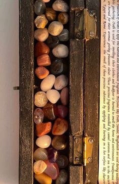 a wooden box filled with lots of rocks