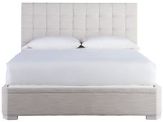 a bed with white linens and pillows on it's headboard, in front of a white background