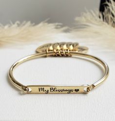 Gold Silver Custom Bangle, My Tribe Bangle, Personalized Bracelet, Mom Bracelet, Grandma Bracelet, Charm Bracelet, High Quality! Available in Gold and Silver. 14k Gold Over Stainless Steel, Durable Bangle Send me a note upon checkout with names/personalization. To care for your jewelry and keep it clean and ready to wear, gently wipe off excess make-up and skin oils after each wearing. Use a nub free, 100% cotton cloth and gently wipe the piece clean using only the soft pads of your fingers. Sto Gold Charm Bangle Bracelet, Charm Bangle Bracelets For Anniversary, Charm Bangle Bracelet For Anniversary, Anniversary Charms Bangle Bracelet, Anniversary Bangle Bracelets With Charms, Grandma Bracelet, Custom Bangle, Mom Bracelet, My Tribe