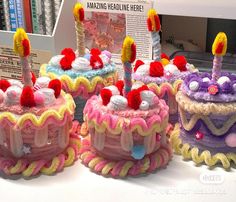 three decorated birthday cakes sitting on top of a table