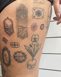 a woman's thigh with various tattoos on it