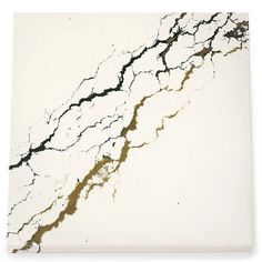 a white and black marble tile with cracks in the middle on an off - white background