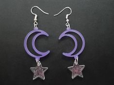 These lightweight purple cresent moon and star earrings are made with resin and glitter to make unique galaxy themed dangle and drop earrings :) Every pair may vary from the original listing as they are all hand made to order. Handmade Moon-shaped Party Earrings, Star And Moon Earrings Dangle, Celestial Purple Dangle Earrings, Handmade Purple Moon-shaped Jewelry, Handmade Purple Celestial Earrings, Purple Moon Earrings, Purple Celestial Dangle Earrings, Whimsical Moon-shaped Handmade Earrings, Musical Outfits