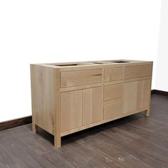 a wooden cabinet with two sinks in it