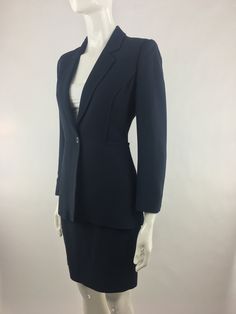 "Vintage 1990's Cheap & Chic by Moschino dark navy blue two piece suit (blazer and skirt) has a classic cut and minimalist design that makes it an excellent choice for a job interview or for the office. The navy blue blazer has lapels; long sleeves; light interior shoulder padding front single button closure; and interior lining. The matching navy blue skirt has a back zipper closure and back vent in the center near the lower hem. Made in Italy Garment has been pinned to mannequin to illustr Graduation Suit, Interview Suits, Dark Blue Blazer, Dark Blue Suit, Office Suit, Blue Two Piece, Navy Blue Skirt, Navy Outfit, Navy Blue Suit