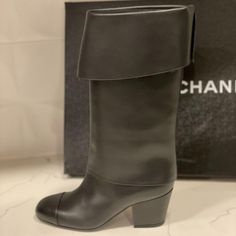 Chanel 2020 (20k) Calfskin Leather Pull On Boots Have A Tonal Cap Toe With 2.25" Leather Heel. Musketeer Style Foldover Detail. Goldtone Cc Logo At Inner Side Of The Right Boot. Padded Leather Insole. Leather Sole. Shaft: 11". Made In Italy. Designer Color: Black. Pull On Style (No Zipper). Size: 36 Eu (Top Opening: 14.5 Around") Typically Chanel Shoes Run Small. Brand New With The Box. Chanel 2020, Pirate Boots, Chanel Boots, Boots Heels, Pull On Boots, Leather Pulls, Cc Logo, Chanel Shoes, Vintage Chanel