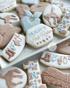 decorated cookies are sitting on a white plate