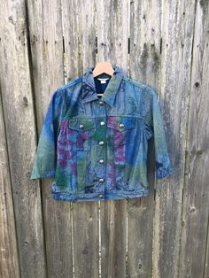 This denim jacket is ready for a great life. If you want something that will go over another piece of clothing and look great doing it, get this now. It is in great condition and has no rips, holes, stains or smells. Measurements: Pit to pit: 18 1/4 inches Collar to bottom front: 17 1/2 inches Collar to bottom back: 21 inches Sleeve Length (from collar): 20 inches Size on tag: Small Multicolor Denim Jacket With Pockets For Spring, Multicolor Denim Jacket With Pockets For Fall, Multicolor Cotton Denim Jacket Casual, Casual Multicolor Cotton Denim Jacket, Multicolor Cotton Denim Jacket For Spring, Multicolor Cotton Denim Jacket For Fall, Fitted Multicolor Denim Jacket For Fall, Multicolor Cotton Denim Jacket With Long Sleeves, Spring Outerwear Relaxed Fit Pre-washed