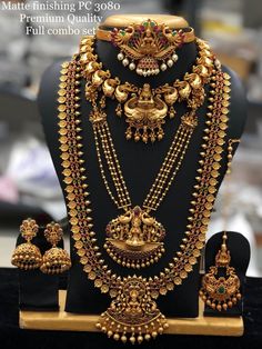 an elaborate necklace and earrings set on display