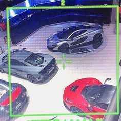 there are four different models of cars on display