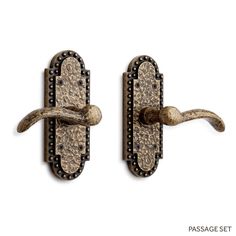 two antique style door handles with decorative knobs