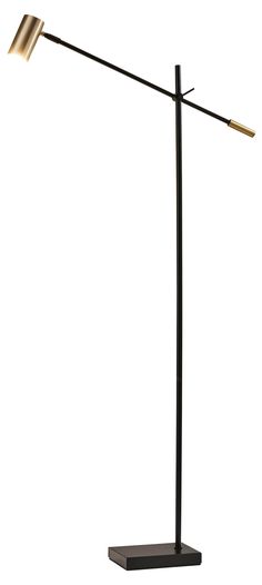 a black and gold floor lamp on a white background