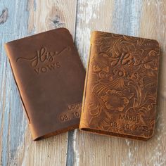 two personalized leather bible covers on a wooden table with the word, his vows written in cursive writing