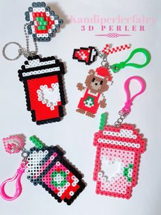 cross stitch keychains with various items on them and the words, kawaipe for fairy 3 d 'pperer