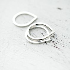 Obsessed with this ring shape. by Minicyn Stackable Sterling Silver Teardrop Jewelry, Minimalist Teardrop Stackable Jewelry, Silver Sterling Teardrop Rings, Silver Sterling Silver Teardrop Rings, Silver Teardrop Sterling Silver Rings, Silver Teardrop Ring With Polished Finish, Modern Silver Teardrop Ring, Modern Teardrop Anniversary Rings, Minimalist Sterling Silver Teardrop Rings