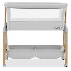 the evluu baby changing table is shown in grey and white with two baskets underneath it