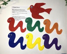 an art project made out of felt with birds and letters