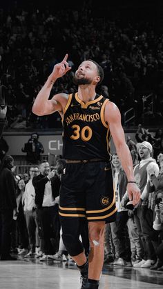 a man standing on top of a basketball court