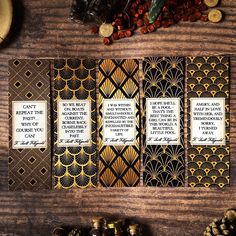 three bookmarks with words on them sitting on a table next to some nuts and other items