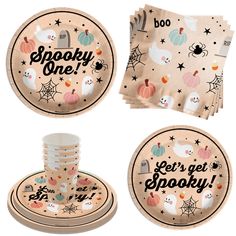 halloween themed paper plates and napkins with spooky one lettering on the front