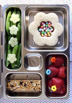 a metal tray filled with different types of food