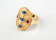 🎁 FREE Worldwide Shipping with DHL & FedEx EXPRESS Assured, fast delivery. ✈ ║║Solid Gold Byzantine Design Wide Ring - Goldsmith Jewelry Workshop║║ ON SALE 15% OFF 🎁 UNIQUE JEWELRY DISCOUNT ► Solid Gold 18K. ► Sapphire and ruby natural stones. ✪ Natural Sapphire: 0.62ct (all together) ✪ Natural Ruby: 0.16ct (both together) ❚ Dimensions: 2.2 x 1.5cm at top ❚ Bottom band: 0.4cm width WE CREATE FULL CUSTOM MADE , HIGH END JEWELRY LEAVE US YOUR MESSAGE TO DISCUSS YOUR IDEAL PIECE ☼ Thank you! Gold Multi-stone Oval Sapphire Ring, Gold Oval Multi-stone Birthstone Ring, Gold Multi-stone Sapphire Ring With Oval Shape, Gold Oval Sapphire Ring With Multi-stones, Oval Yellow Gold Rings With Stones, Gold Multi-stone Oval Cabochon Ring, Byzantine Oval Gemstone Jewelry, Byzantine Style Oval Gemstone Jewelry, Oval Byzantine Gemstone Ring