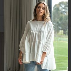 Maya Blouse - White, Equivalent To A Us6 But It Runs Oversized. Main |65% Cotton 35% Linen Oversized, Smock Styled Top With Trapeze Flare Tiered Style Elasticated Cuff Extended Key Hole Back With Button Closure The Neckline And Armhole Fits True To Size, All Other Points Of Fitting Are Oversized. We Would Suggest Going Down At Least One Size. Nwt, Open To Reasonable Offers! Billowy Cotton Top For Day Out, Casual White Peasant Top With Balloon Sleeves, Feminine Cotton Blouse For Layering, Chic Oversized Blouse For Day Out, Chic Oversized Tops For Brunch, Oversized Long Sleeve Blouse With Ruffles, Billowy Tops For Daywear In Fall, Billowy Tops For Fall Daywear, White Balloon Sleeve Blouse With Relaxed Fit