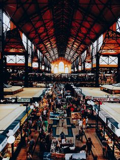 an indoor market filled with lots of people