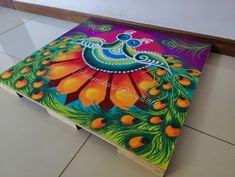 an artistically painted box sitting on the floor