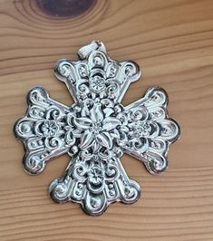 an ornate metal object on top of a wooden table