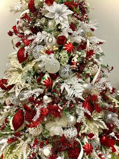 a christmas tree decorated with red and white ornaments