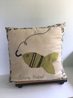 a pillow that has a fish on it