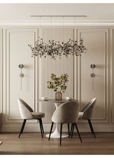 a dining room table with chairs and a plant hanging from the ceiling above it, in front of a white paneled wall